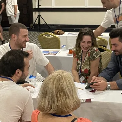 ICRON team members collaborating and laughing during workshop