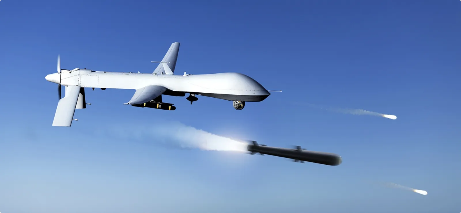 Armed unmanned aerial vehicle in flight demonstrating precision and real-time mission control