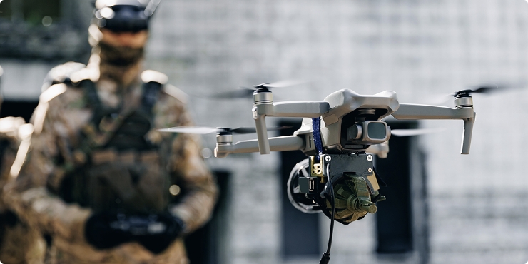 Military engineers operating tactical drone for advanced defense intelligence and operational visibility