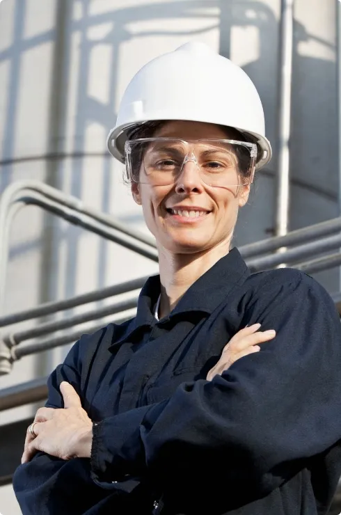 Female engineer at industrial plant ensuring safety and operational excellence in supply chain