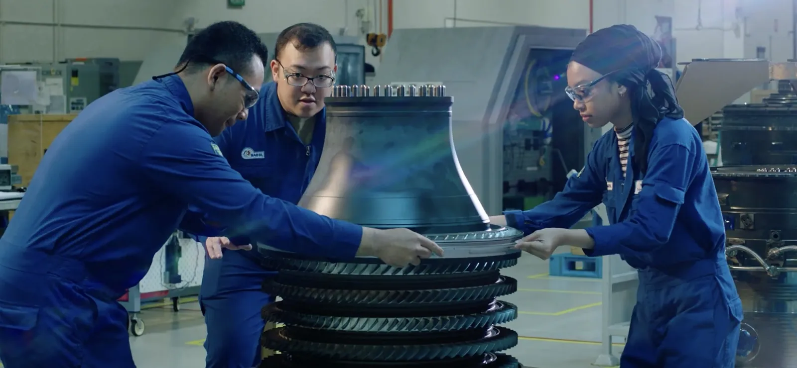 Technical team inspecting turbine parts to ensure quality and performance in aerospace manufacturing