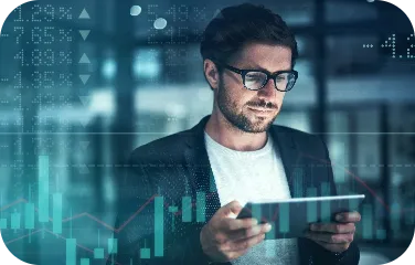 A business analyst reviews forecast graphs to align procurement and blending with demand projections.
