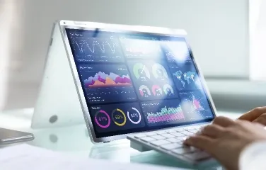 Person analyzing business dashboards on tablet