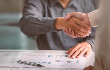 Business handshake over performance reports