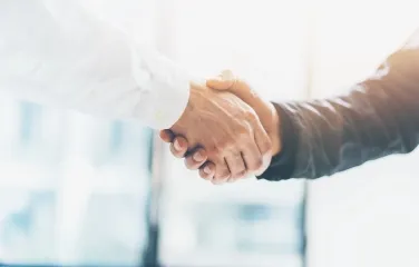 Close-up handshake symbolizing partnership and trust