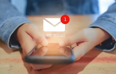 Person receiving a new message notification on smartphone