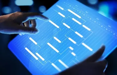Hands using digital touchscreen with data visualization for planning