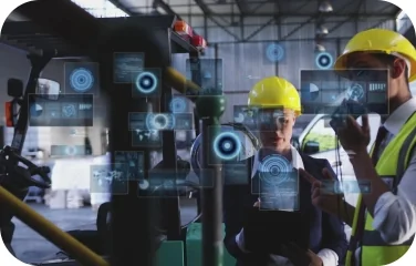 Factory workers reviewing cost data through augmented reality overlays