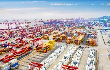 Aerial view of large logistics port with shipping containers