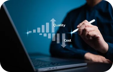 Hand writing beside a quality and cost trade-off chart on a laptop