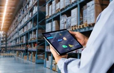 Supervisor reviewing warehouse dashboard on tablet