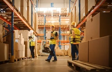 Logistics team managing warehouse operations with digital tools
