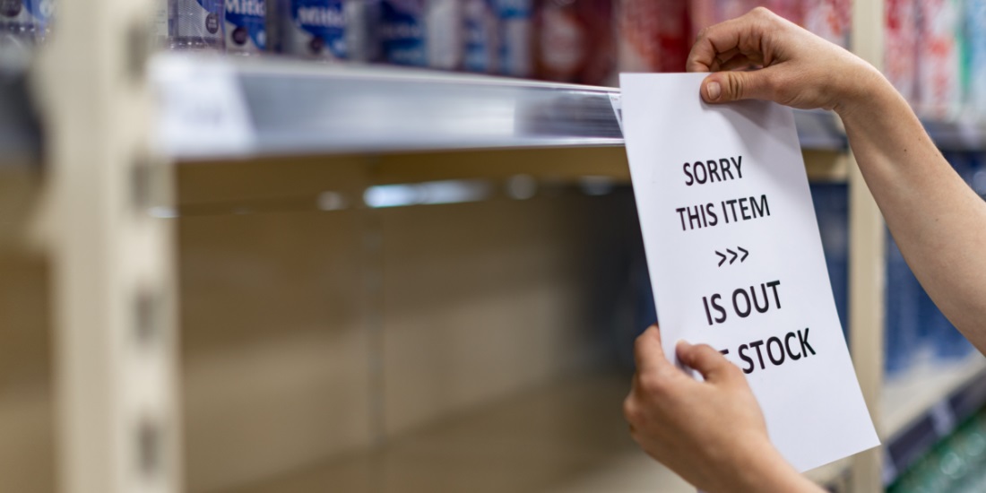 Retail shelf showing out-of-stock notice due to poor inventory planning in the supply chain.