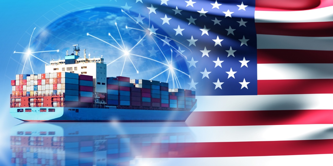 Cargo ship and American flag symbolizing the impact of US trade policy changes on global supply chains