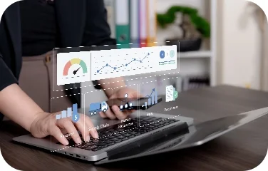 A planner reviews scenario-based planning dashboards on a laptop.