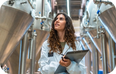 A production manager reviews tank operations to support efficient scheduling and sequencing.