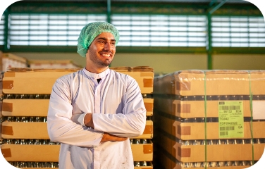 A quality analyst inspects production output to help maintain shelf life and product freshness.