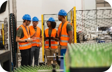 Plant staff discuss production conditions to align capacity and resource planning.