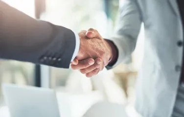 Handshake symbolizing strategic supply chain partnership and collaboration